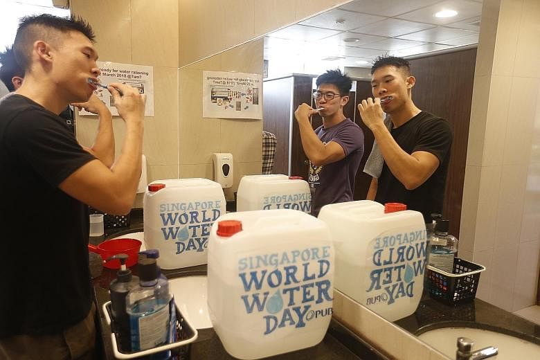 Students - and staff - of Ridge View Residential College brushed their teeth (above), washed their hands and bathed using jerry cans and buckets (right) yesterday as part of NUS' save-water campaign.