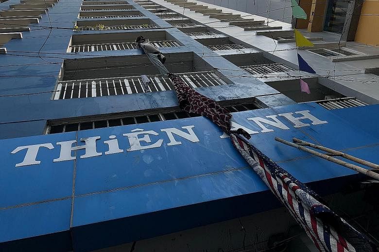 Some residents trapped in the burning building in Ho Chi Minh City tried to escape by tying sheets together and fashioning a rope. An official said many of the victims died of suffocation as they tried to flee the fire by running to the higher floors