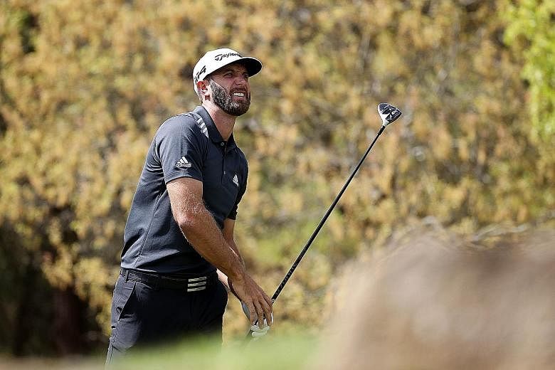 American world No. 1 Dustin Johnson watching his tee shot at the fifth hole in his second group match at the WGC Matchplay on Thursday. The defending champion enjoyed his only birdie of the round here and was knocked out of the event after losing 4 a