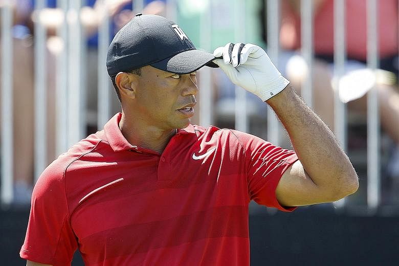 Tiger Woods, in his trademark red shirt on the final day of the Arnold Palmer Invitational tournament at Bay Hill last weekend, where he finished tied for fifth. One Las Vegas bookie has installed him as the favourite for the Masters next month.
