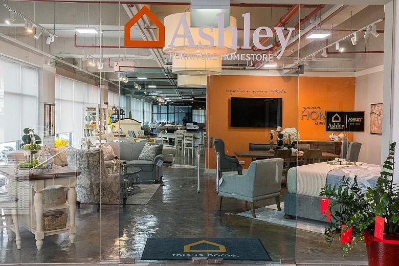 Ashley Furniture HomeStore launched its Singapore store (left) in North East Building in Kallang Way yesterday.