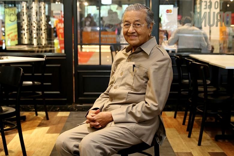 Tun Dr Mahathir Mohamad at The Loaf bakery-cafe in Cyberjaya last Wednesday. He now leads Malaysia's opposition alliance and his schedule in the run-up to the general election has been punishing.