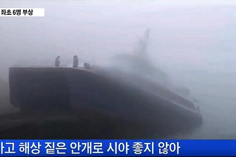 A screen grab from a TV Chosun news clip on yesterday's ferry accident off South Korea's western coast. The text says visibility was low due to fog.