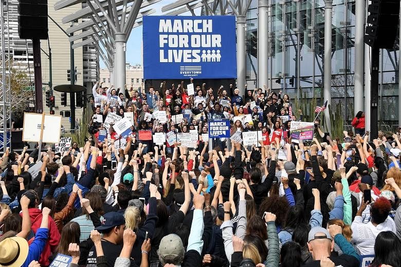 Protesters at the March For Our Lives rally on Saturday in Las Vegas, where a gunman killed 58 people at a country music festival last year. More than 800 demonstrations were scheduled in the US and overseas, said coordinators, with events as far as 