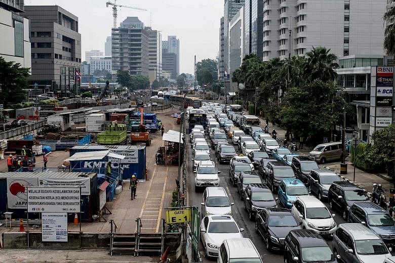 Heavy traffic next to an MRT construction site in Jakarta this month. Electronic Road Pricing will be implemented after the MRT has commenced operations, said Deputy Governor Sandiaga Uno.