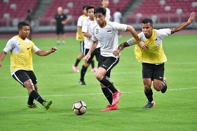 Ikhsan Fandi (centre) in action during training at the National Stadium. The 18-year-old forward was an unused substitute in last Friday's 3-2 friendly win against the Maldives but is likely to feature against Chinese Taipei today.
