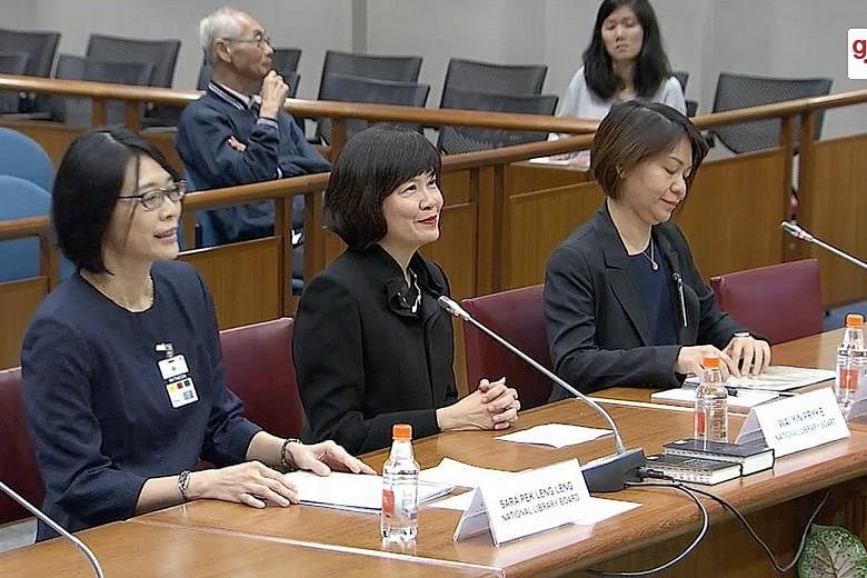 The National Library Board's director Wai Yin Pryke (centre) at the hearing yesterday, with senior manager for engagement Sara Pek Leng Leng (far left) and assistant director for content and services, general reference, and statutory and digital cont