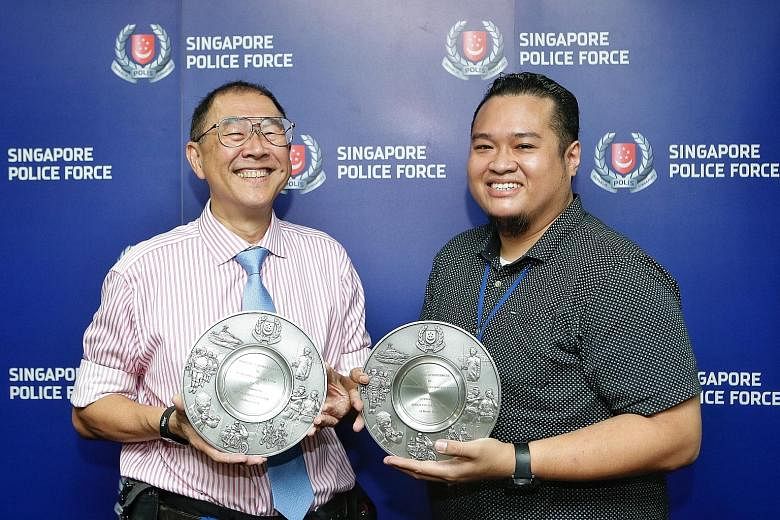 Dr Michael Lim (left) and Mr Mohammed Noh Abdul Sukor were among the eight who got the Public Spiritedness Award from the Bedok police.