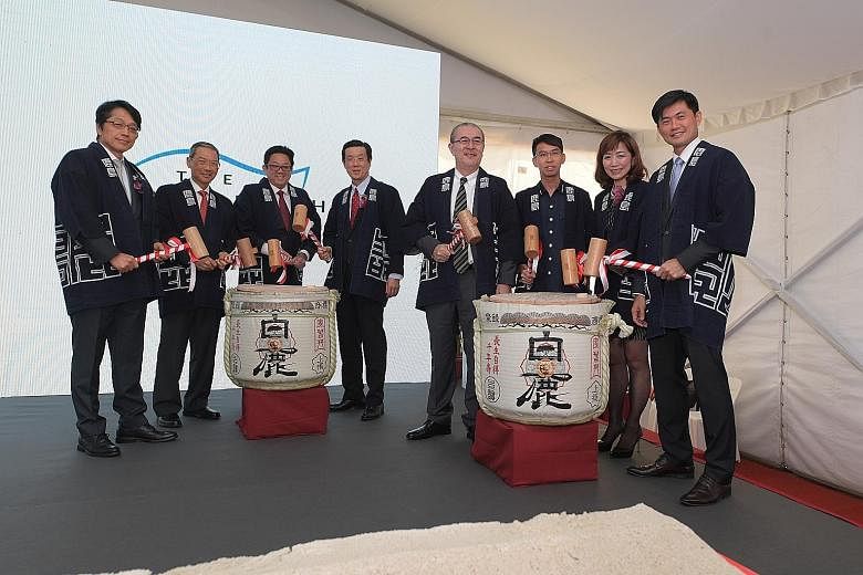 An artist's impression of The Woodleigh Residences, which offers condominium units ranging from two-to four-bedders. At The Woodleigh Residences and Mall ground-breaking ceremony were (from left) Kajima Corporation senior managing officer Keisuke Kos