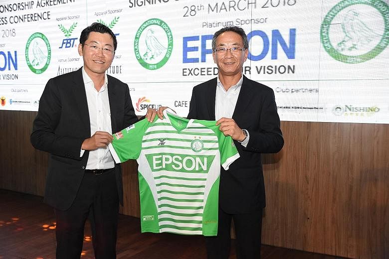 Geylang International chairman Ben Teng (far left) and Epson Singapore managing director Toshimitsu Tanaka inked a one-year extension, understood to be worth $100,000, to their sponsorship deal at 1-Altitude yesterday. Teng said: "It's not easy to fi