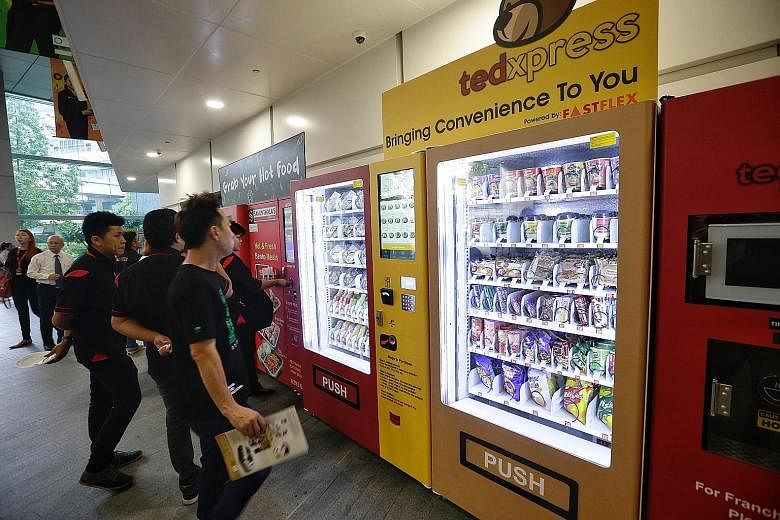 Food vending machines at ITE College East. Students in the development stage of the project will be involved in creating recipes and new food vending technologies which may be introduced to the market.