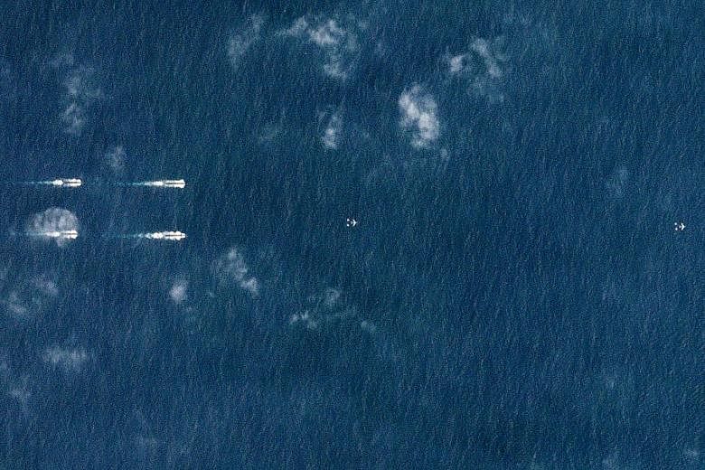 A satellite image from Monday showing Chinese navy ships south of Hainan island in the South China Sea.