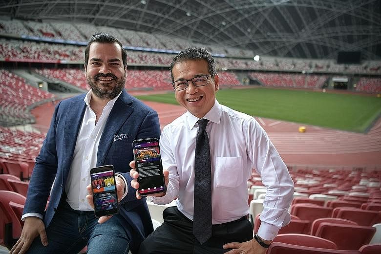 FAS vice-president Edwin Tong and Converzion chief executive James Nicol showing off the mySPL web application. The Singapore Premier League's digital push is a key part of the league's rebranding.