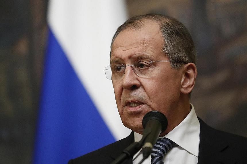 Above: Russian Foreign Minister Sergei Lavrov said the measures against the US include expelling the same number of diplomats as those ordered out by Washington. Left: Russia is also closing the US Consulate in St Petersburg.