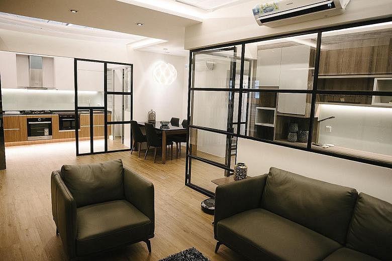 This showflat (above) in Gain City's Sungei Kadut store is the same size as a five-room Housing Board flat, says managing director Kenny Teo (below).