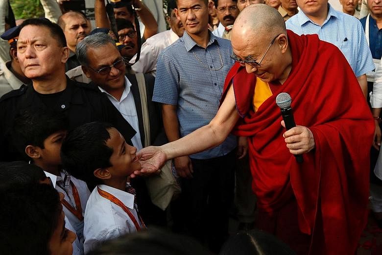The Dalai Lama with pupils at a Mumbai school last year. India has continued to host the Dalai Lama and his fellow Tibetan Buddhist exiles even though China condemns them as dangerous separatists.