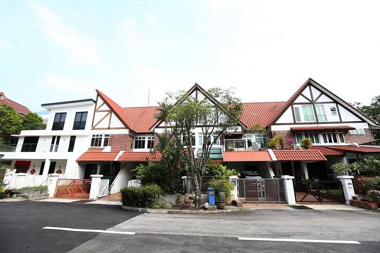 Dr Michael Teo's flat-roofed corner terrace house in Greenridge Crescent stands out among the more than 70 Tudor-style homes that were built in the 1980s.