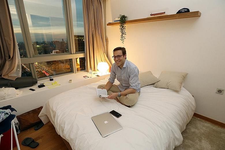 Mr Edouard Chamorel, 26, in his One Shenton apartment run by Hmlet, which handles 50 apartments and three buildings in Shenton Way, Raffles Place, River Valley and Joo Chiat. It organises rooftop parties for clients.