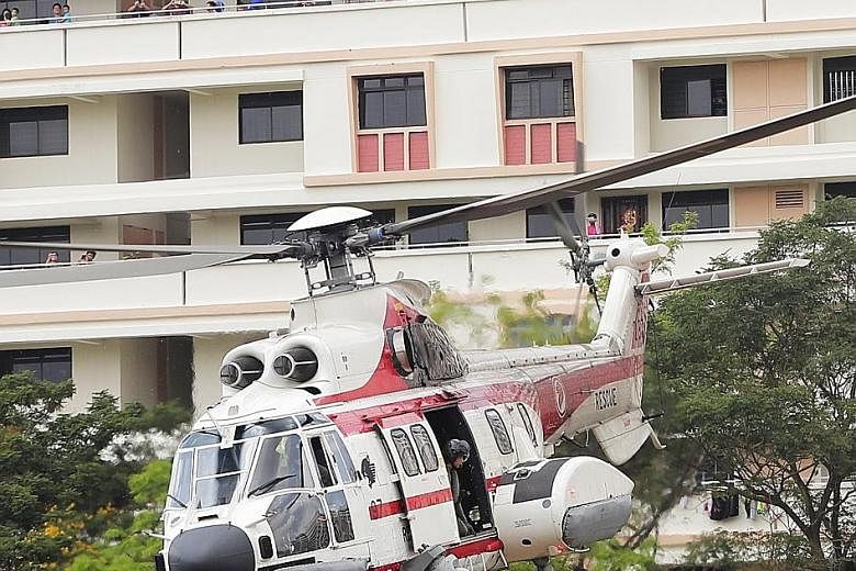 Sembawang residents got a rare treat yesterday when a Super Puma landed in the heart of their town. The open field beside the MRT station became exhibition grounds for a display of the helicopter's search and rescue capabilities, as part of the RSAF'