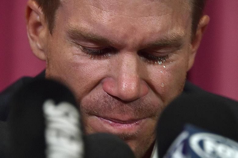 Australian cricketer David Warner crying during a press conference at the Sydney Cricket Ground yesterday. He has taken full responsibility for his role in a ball-tampering scandal but is also weighing up an appeal against his 12-month ban.