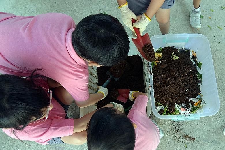 Pre-schoolers working on a compost bin with food waste they collected. Figures from the National Environment Agency show that the amount of food waste generated in Singapore has increased by about 40 per cent over the last 10 years.