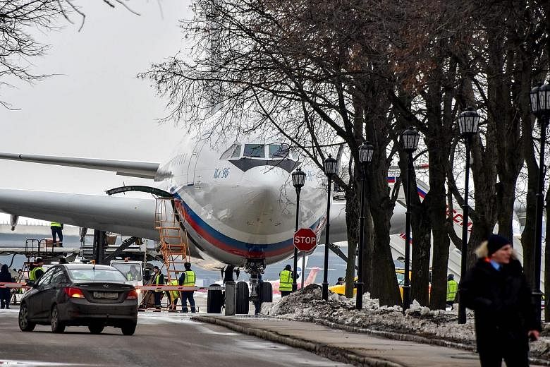 A Russian jet that flew home 46 of the country's diplomats and their family members at the Russian government airport Vnukovo II in Mosow yesterday. Britain, the US and many other Western allies have expelled Russian diplomats over the poisoning of f