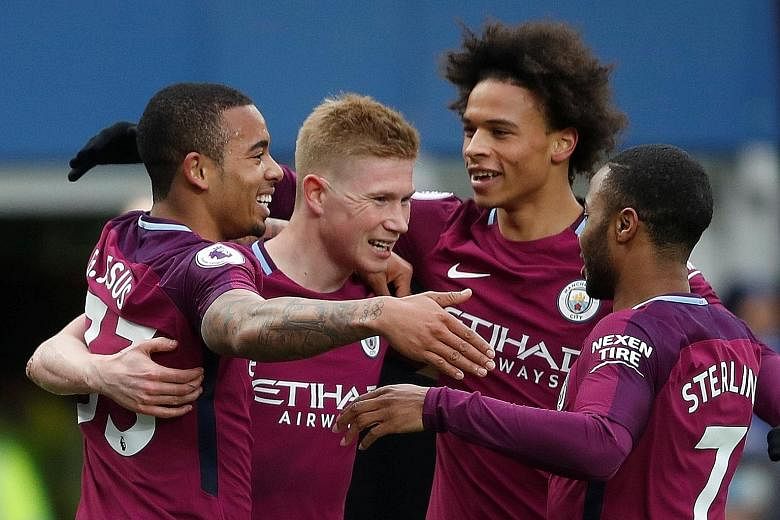 Kevin de Bruyne celebrating with Manchester City's three scorers against Everton - Gabriel Jesus (far left), Leroy Sane and Raheem Sterling. City can seal the EPL title by beating United in Saturday's Manchester derby but, before that, they take on L