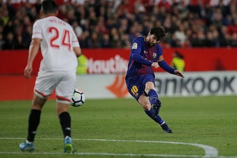 Barcelona substitute Lionel Messi striking from the edge of the box in the 89th minute. He scored to earn Barca a 2-2 draw at Sevilla.