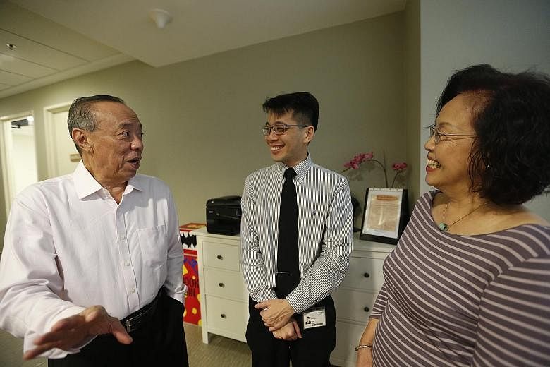Madam Phang Yoke Fah and her husband Lie Tjoen-Jong, both colorectal cancer survivors, with Dr Tan Ker Kan (middle) of the National University Cancer Institute, Singapore. The couple said their brush with cancer underscores the importance of early de