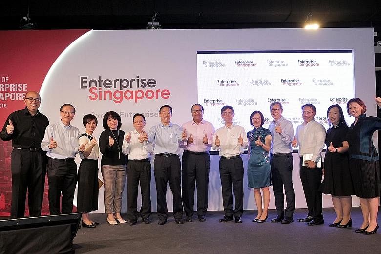 At yesterday's launch of Enterprise Singapore were (from left) assistant CEO Satvinder Singh, deputy CEO Ted Tan, assistant CEO Eunice Koh, assistant CEO Chew Mok Lee, senior adviser Chua Taik Him, CEO Png Cheong Boon, Minister for Trade and Industry