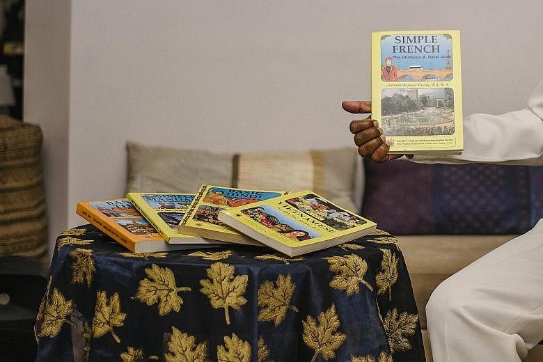 Dr Sivam with the self-study language handbooks that he came up with at the Europhone Institute, which offered languages such as French and Vietnamese. Dr K. P. Sivam at his home in Serangoon with a Mandarin language kit comprising guides, textbooks 