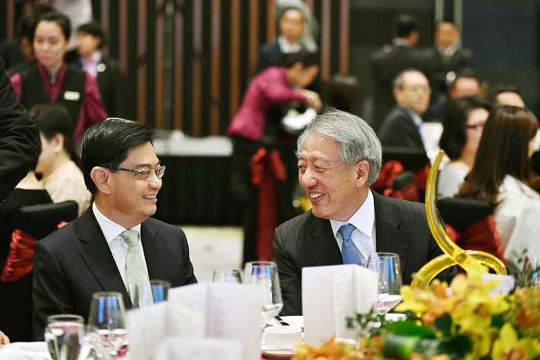 Finance Minister Heng Swee Keat and Deputy Prime Minister Teo Chee Hean, who is also the minister in charge of the civil service, at the annual Administrative Service dinner and promotion ceremony yesterday. Mr Heng had been invited to speak at the e