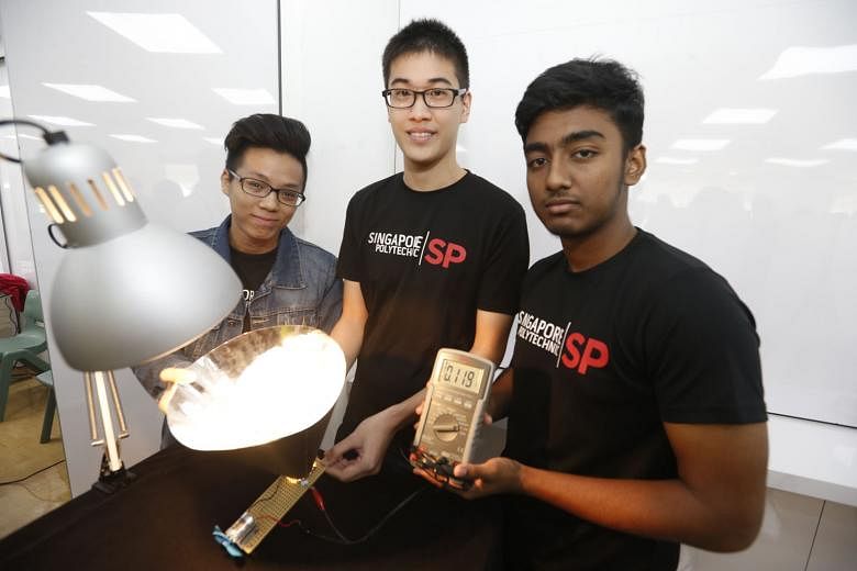 Singapore Polytechnic electrical and electronic engineering students (from left) Lester Loh, 19, Ko Keng Wee, 20, and Md Tanvirul Huda, 19, are working on the Scone - or solar cone - prototype, which can potentially absorb more than five times the so