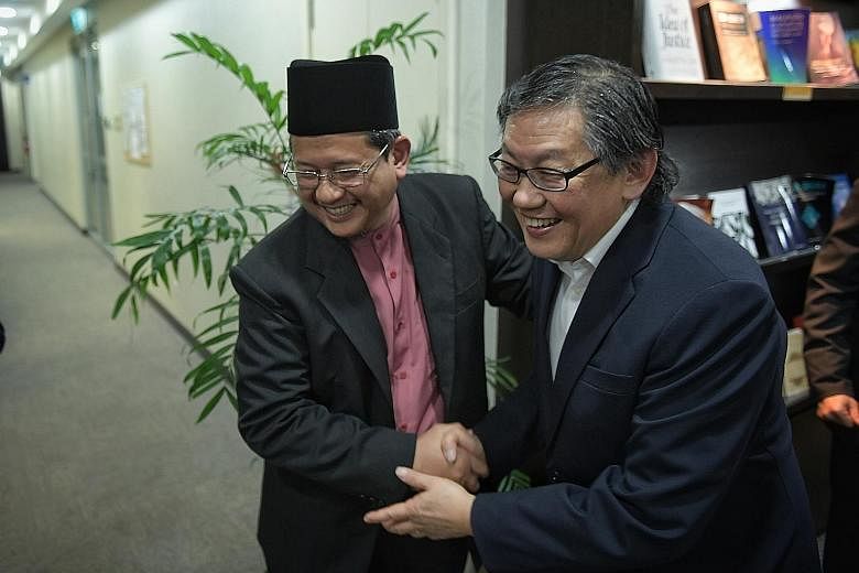 Mufti Mohd Fatris Bakaram and Cornerstone Community Church senior pastor Yang Tuck Yoong at the Singapore Islamic Hub last night. At the meeting with Muslim community leaders, Pastor Yang apologised for the comments made by Mr Lou Engle.