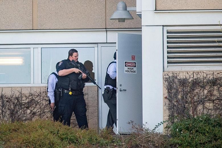 Employees leaving the building after the shooting at YouTube's headquarters in San Bruno, California, on Tuesday. A man was in critical condition and two women were seriously wounded in the attack. The alleged shooter, 39-year-old Nasim Najafi Aghdam