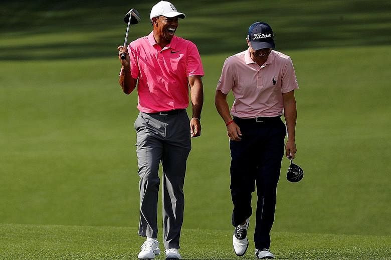 Tiger Woods, in the pink of health, sharing a laugh with fellow American Justin Thomas during practice at Augusta National Golf Club ahead of the Masters. Woods, a 14-time Major champion, is aiming for his fifth Green Jacket after successfully return