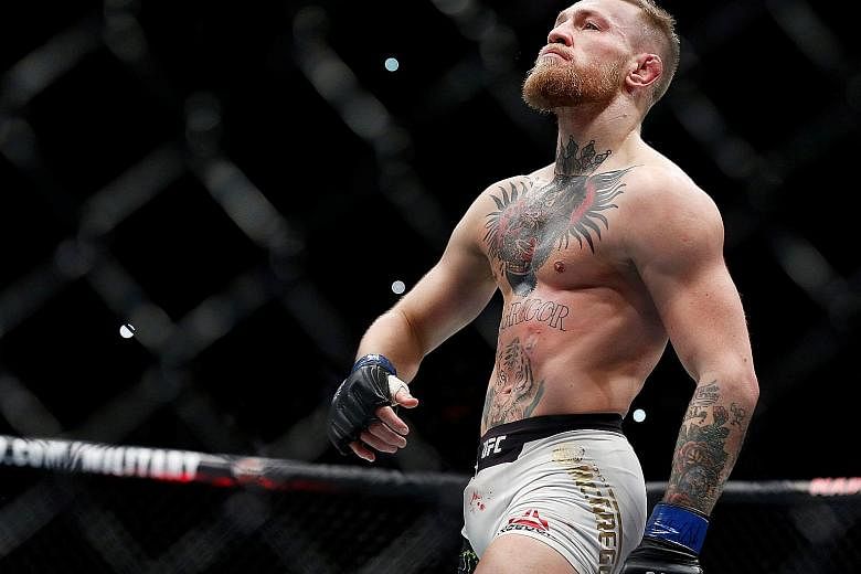 MMA fighter Conor McGregor strutting around in the octagon during happier times. The Irishman, who has not fought in the UFC since November 2016, has cast a shadow over the UFC 223 event in New York today with his actions forcing the cancellation of 