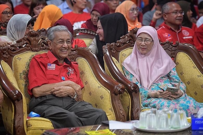 Former Malaysian prime minister Mahathir Mohamad and PKR president Wan Azizah Wan Ismail at the rally in Johor yesterday.