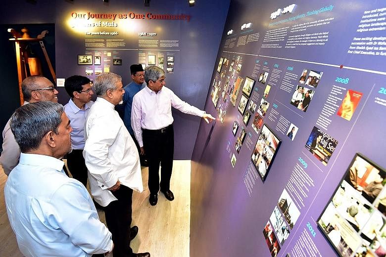 Minister-in-charge of Muslim Affairs Yaacob Ibrahim (far right) with members of Muis' senior management at a new gallery showcasing the history of Muis at the Singapore Islamic Hub yesterday.