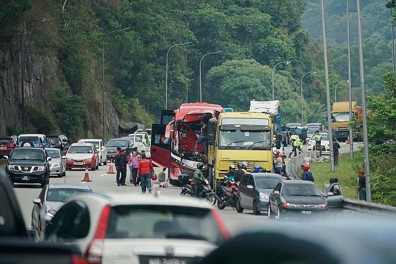 The accident involving a bus and a lorry on the Karak-Kuala Lumpur Expressway yesterday involved 11 Singaporeans and three Malaysians, including the driver and the bus conductor.