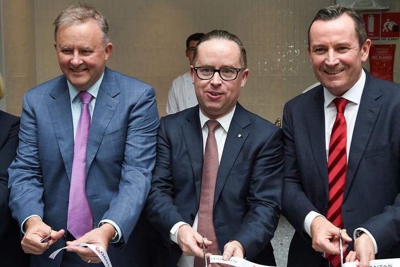 Qantas chief executive Alan Joyce, flanked by politician Anthony Albanese (far left) and Western Australian Premier Mark McGowan, opening the new transit lounge at Perth Airport before the inaugural Qantas flight from Perth to London last month.