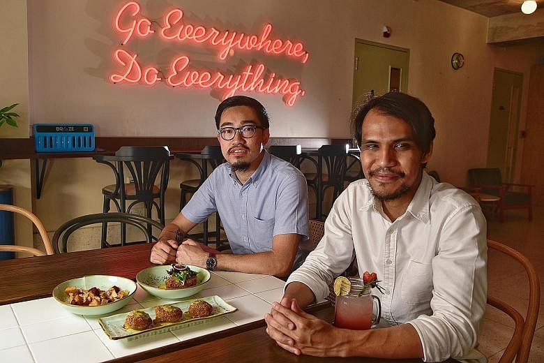 The Black Hole Group founders Calvin Seah (left) and Mustaffa Kamal at their latest restaurant The Great Mischief, which opened in February and serves Catalan-inspired tapas. It is one of five restaurants operated by the group, which focuses on halal