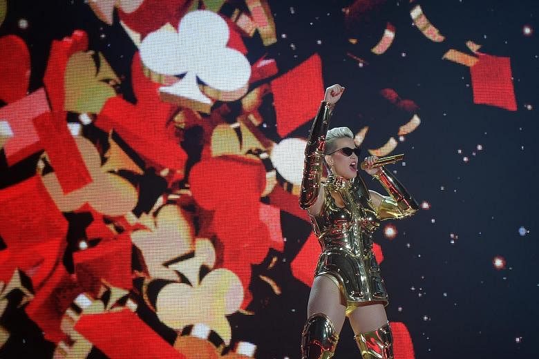 Katy Perry performed in an array of costumes on a large stage with fancy set-ups.