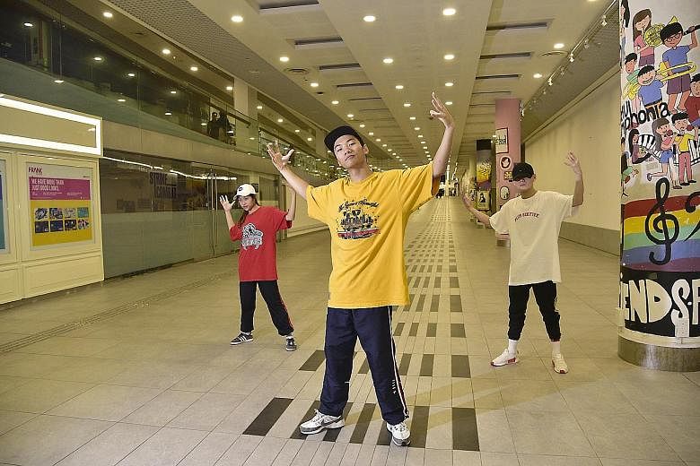 Hip Hop dancers (from left) Andrea Muhammad, Tyron Cheah and Jason Kang at the SMU basement. One downside to using public spaces is having to make way for the university's students when they need the space, said Ms Andrea. Lighting technician Ong Yon