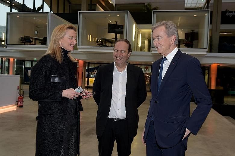 (From left) Ms Delphine Arnault, Mr Xavier Niel and LVMH boss Bernard Arnault at Station F in Paris on Monday.
