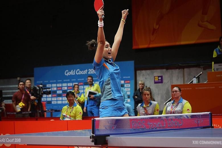 Manika Batra of India celebrating after winning gold against Singapore in the Commonwealth Games women's team event final last Sunday. Her win over world No. 4 Feng Tianwei in the first match set the tone for the 3-1 win.