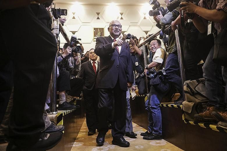Election Commission chairman Mohd Hashim Abdullah arriving for a press conference in Putrajaya yesterday. The commission has said that Malaysians living in Singapore, south Thailand, Brunei and Indonesia's Kalimantan must return to their home states 