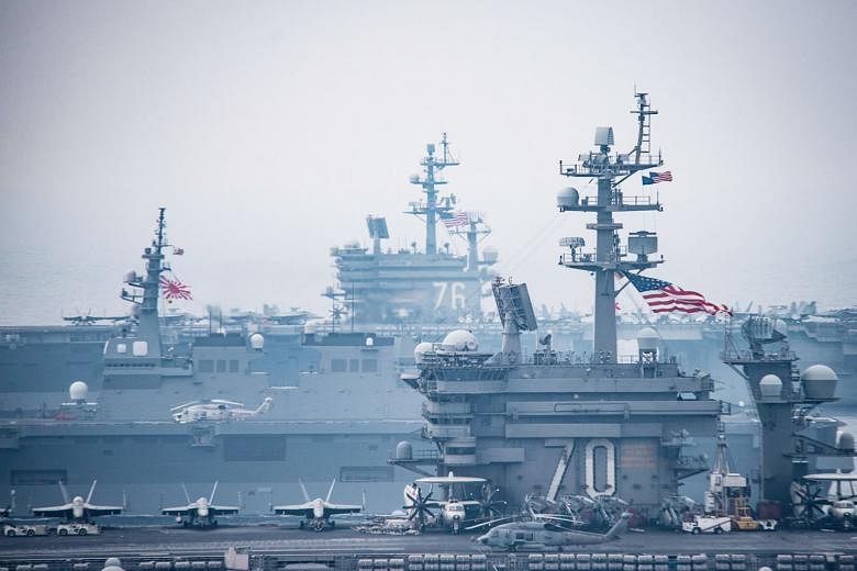 A handout photo released by the US Navy last year showing US aircraft carriers during a joint naval drill with Japanese ships in the Sea of Japan, also known as the East Sea, off the Korean peninsula. Japanese maritime power has been vital in exertin