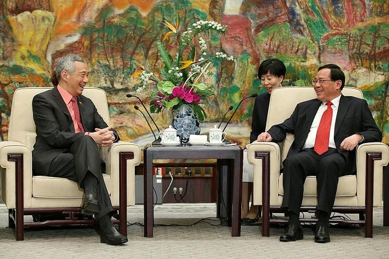 Prime Minister Lee Hsien Loong with Shanghai party secretary Li Qiang yesterday. Both agreed their cities could boost cooperation in four areas, including using Singapore as a global platform for Shanghai businesses.