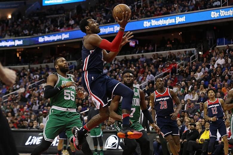 Wizards guard John Wall shooting the ball at the Capital One Arena in Washington during their 113-101 win over the Boston Celtics. Both teams could face each other again in the play-offs, should the Wizards finish seventh in the Eastern Conference.